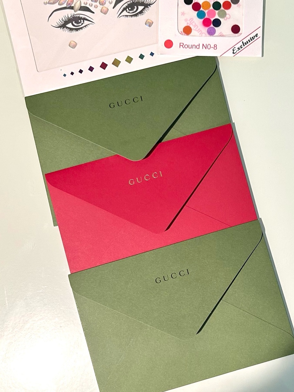 Authentic Gucci Collectible Green/Red Logo Embossed Presentation Envelope Trio.